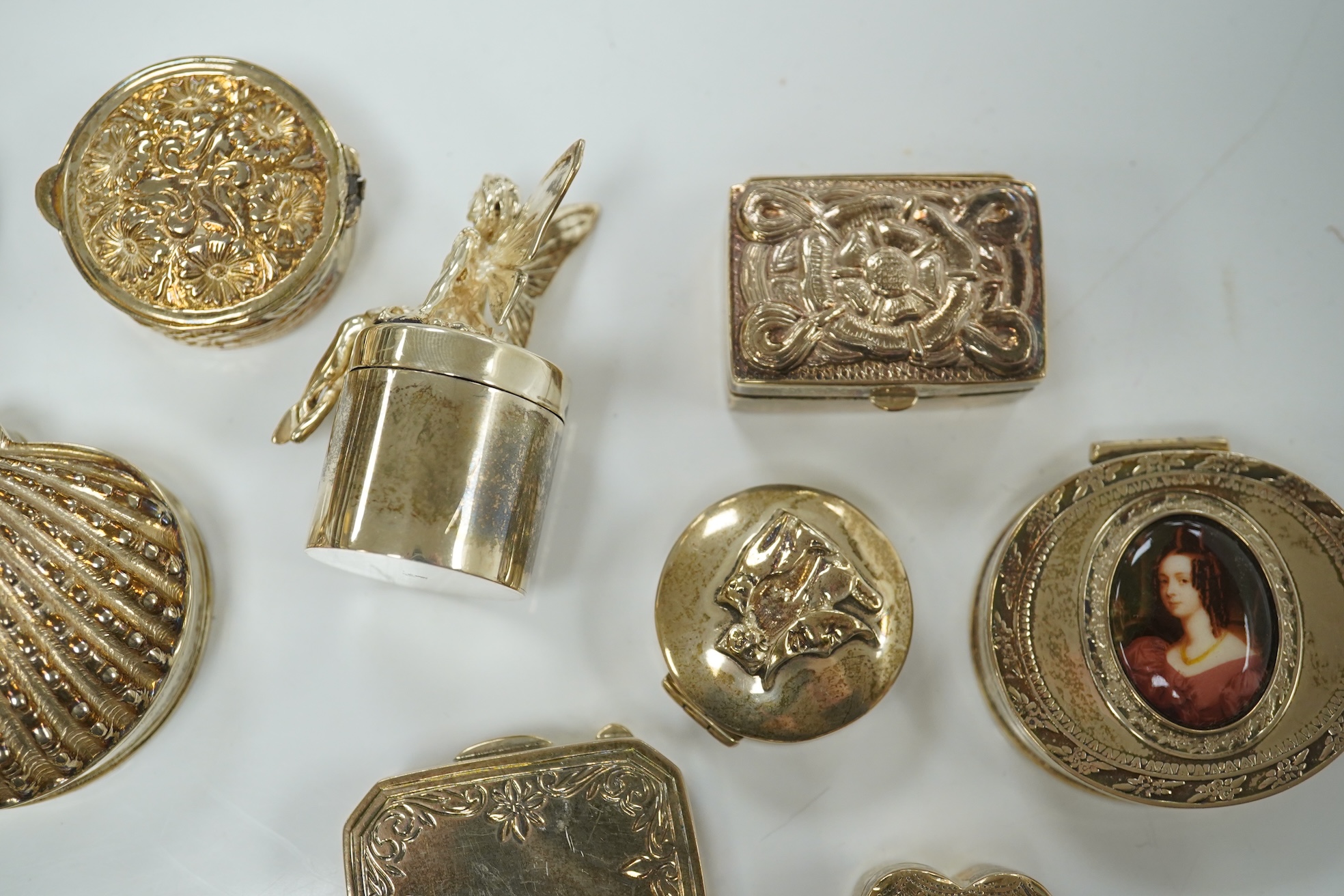 A group of modern silver, white metal or 925 miniature boxes, including novelty sweet in wrapper and banjo. Condition - fair to good.